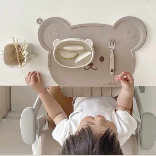 kid enjoying food with chocolate placemat